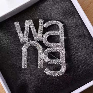 WANG BROOCH